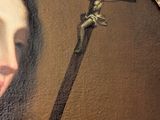 painting of a woman with a cross and a crucif