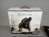 a box of call of duty on the table next to a keyboard