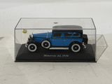 a blue model of a car in a clear case