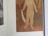 an open book with a picture of a naked man on it
