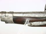 an old gun with a wooden barrel and a metal handle