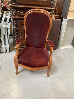 a chair with a red upholstered upholstered seat