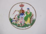 a picture of a plate with a picture of a family on it