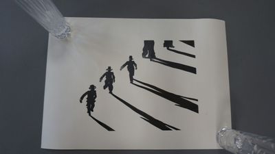 a drawing of a group of people on a sheet of paper