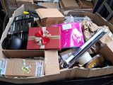 a pile of boxes and other items in a trash can