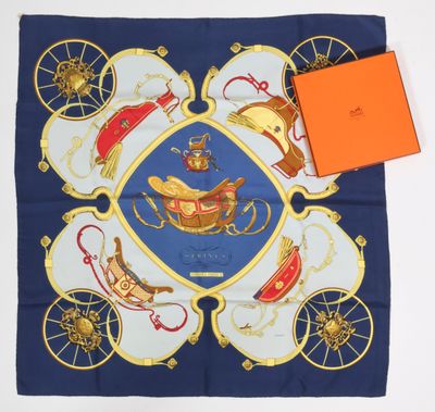 a blue scarf with a picture of a horse drawn carriage on it