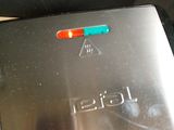 a close up of a toaster on a table