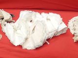 several pieces of cloth are laid out on a red cloth