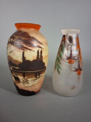 two vases sitting next to each other on a table