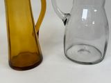 two vases that are next to each other on a table