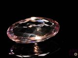 an image of a pink diamond on a black surface