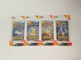 Trois paquets de cartes à collectionner Pokémon sont posés sur une surface blanche.