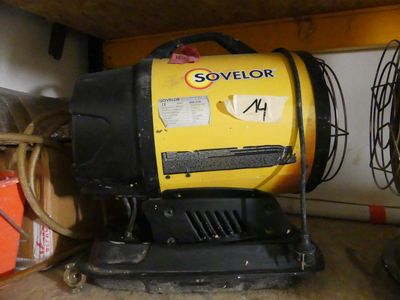 a yellow and black blower sitting on the floor