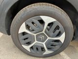 a close up of a car ' s tire on the street