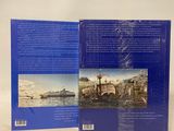 an open book with a picture of a boat in the water
