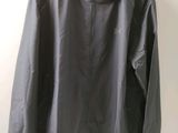 an image of a black jacket hanging on a hanger