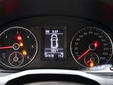 a close up of a car dashboard with various gauges