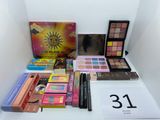 a lot of cosmetics and makeup products on a table