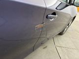 a close up of a car door handle with a sticker on it