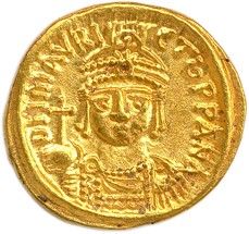 une pièce d'or à l'effigie d'un homme coiffé d'une couronne