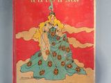 a book with a picture of a woman in a blue dress