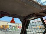 a view of a construction site through the window of a vehicle