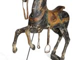 statue of a wooden horse on a stand on a white background