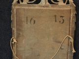 an old wooden clock with a rope around it