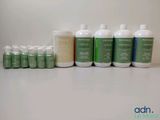 many bottles of green liquid sitting next to each other