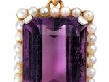 an amethorate and pearl pendant on a white background