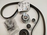 a close up of a timing belt, belt, and bearing kit