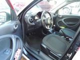 the interior of a car with the door open showing the steering wheel and dashboard