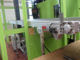 a picture of a machine that is working on a piece of metal