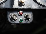 a close up of a car dashboard with a lot of buttons