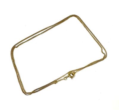 a close up of a gold chain with a clasp on a white background