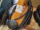 an image of a corded sander and other tools on a table