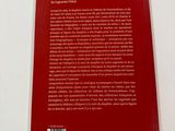 the back cover of a red book on a white surface