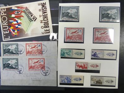 several different stamps are on display on a black table