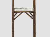 a tall wooden table with a shelf on it