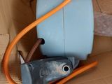 a box with a hose and a water tank inside of it