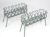 pair of wrought iron garden benches with hearts on them