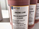 three bottles of encree lv40 are lined up on a table