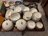 a table with a lot of dishes and bowls on it