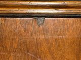 a close up of a piece of wood with a brown stain