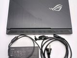 the asus laptop is sitting on top of a table with a charger