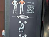 an image of a parking meter with stickers on it