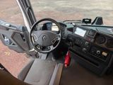 a view of the inside of a vehicle from the driver ' s seat