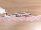 pink polka dot headband with black and white stripes