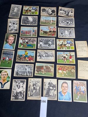 a lot of old football cards on the table