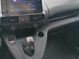 the interior of a car with a touch panel and a steering wheel